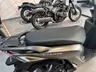 Scooter Honda Vision 110 color marrón metálico con asiento negro