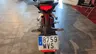Vista trasera de una moto Honda CB125R con matrícula española