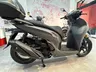 Honda SH 350i gris rock mate con baúl trasero