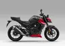 Honda CB750 2027 roja y negra vista lateral