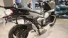 Vista trasera de una moto Honda X-ADV gris con maletas laterales