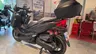 Honda Forza 350 negra vista trasera con baúl