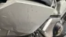 Detalle de rasguños en el carenado lateral de una moto Honda X-adv