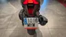 Vista trasera de una moto Honda Forza 125 con matrícula española.