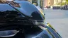 Detalle frontal de una moto Honda SH350i en color negro.