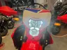 Frontal de moto Honda CRF300L roja con faro led encendido con luz larga